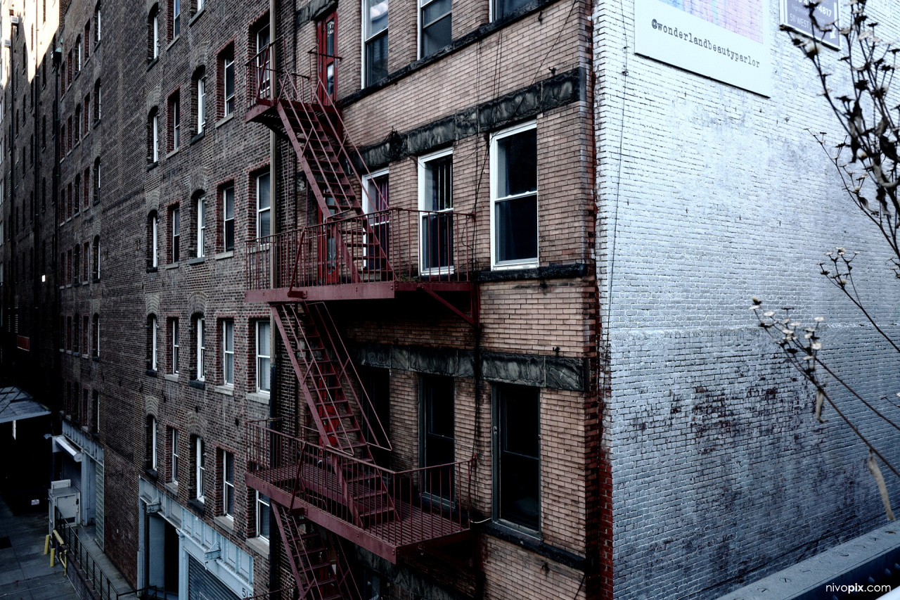 Old brick building with fire escape, New York City, USA