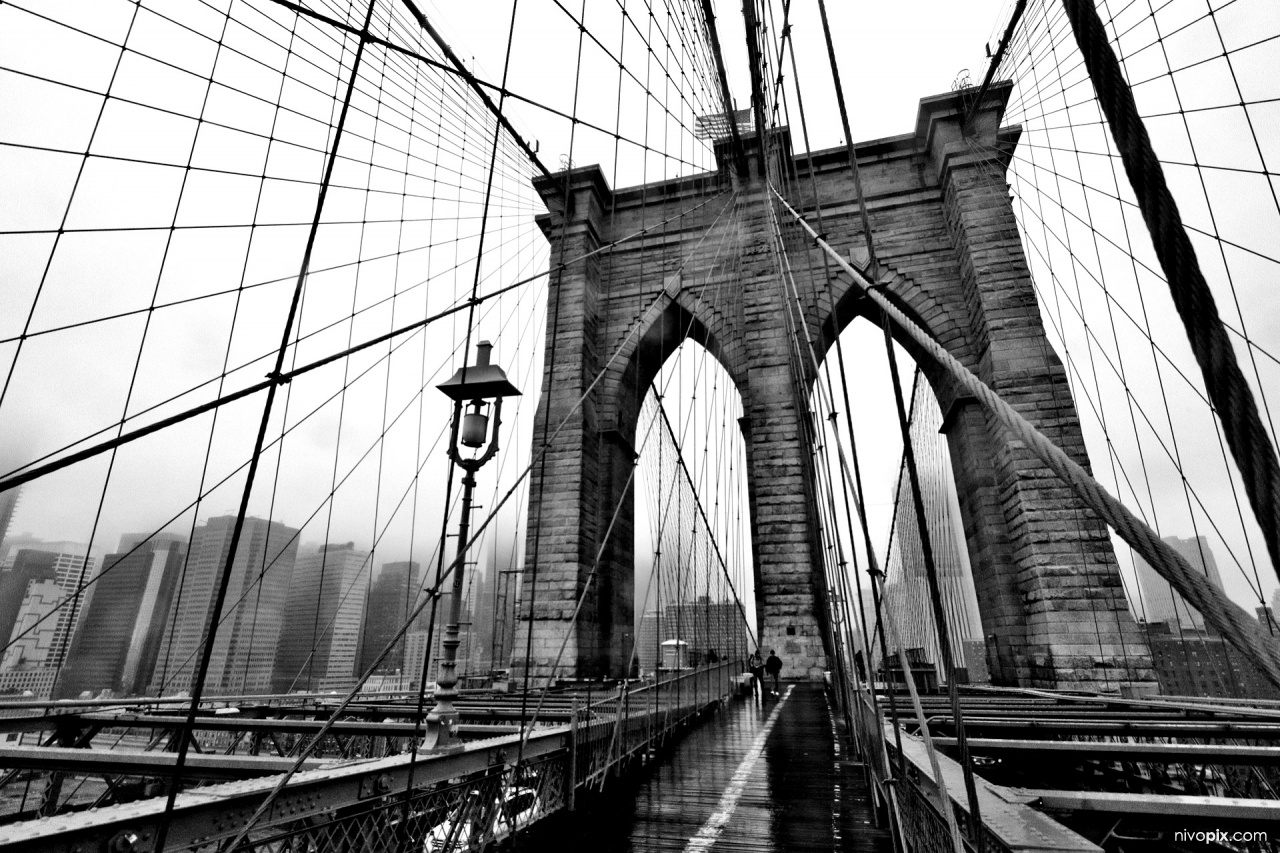 Brooklyn Bridge tower in a foggy day