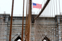 USA flag in the top of the Brooklyn Bridge