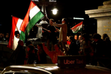 A crowd celebrating the election results on the Chain Bridge.