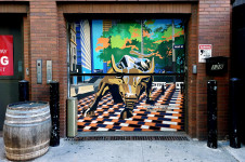 Charging bull mural - Wall Street Grill