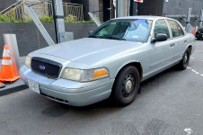 front of a NYPD Ford Crown Victoria Police Interceptor (CVPI)